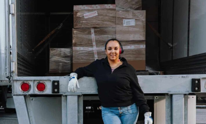 Rectangle-1-2-1 woman in front of truck