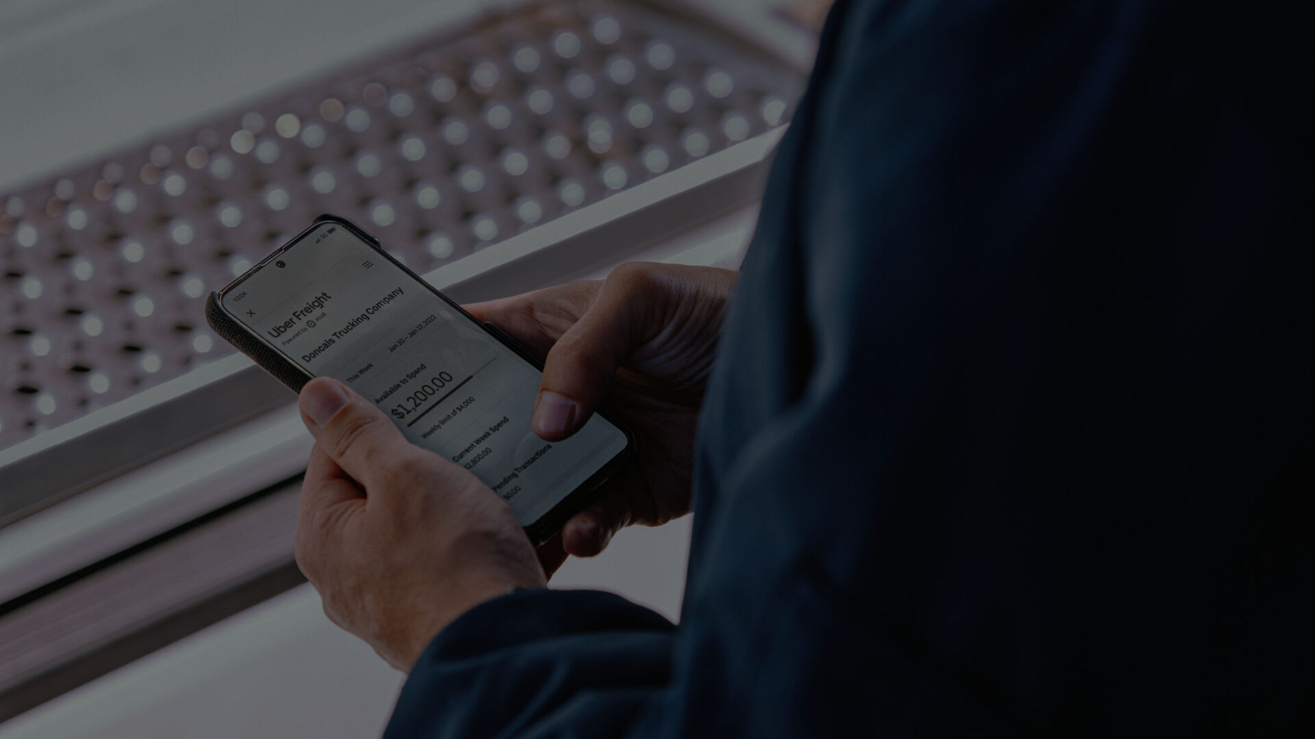 logistics_applications_header person holding mobile phone